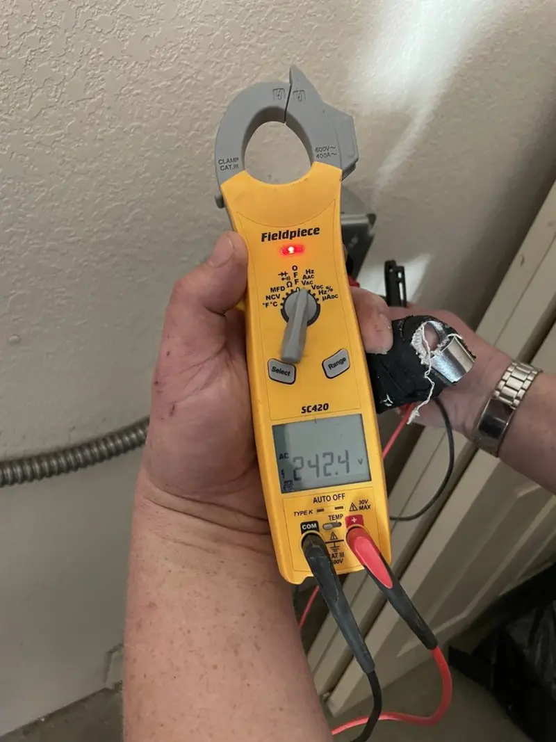 Voltage testing with clamp meter during Outlet Installation in Kermit